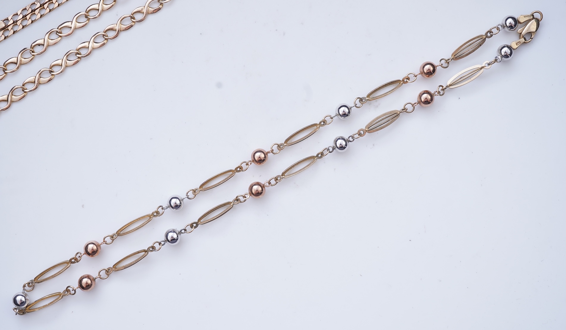 Three gold necklaces